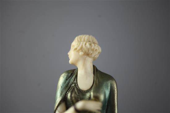 An Art Deco cold painted bronze and ivory figure of a Society lady, height 8.5in.